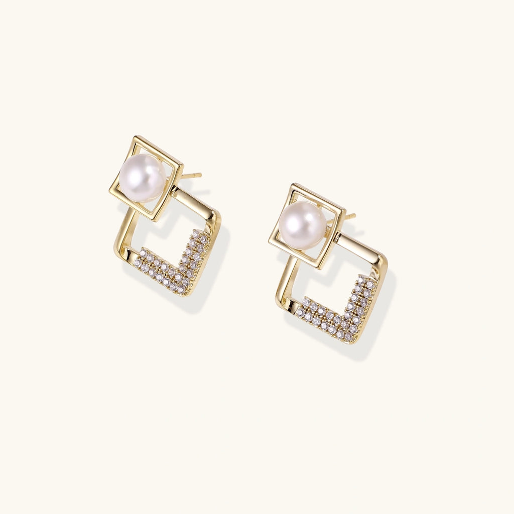 Gold-plated double square frame earrings with freshwater pearl and crystal accents on white background