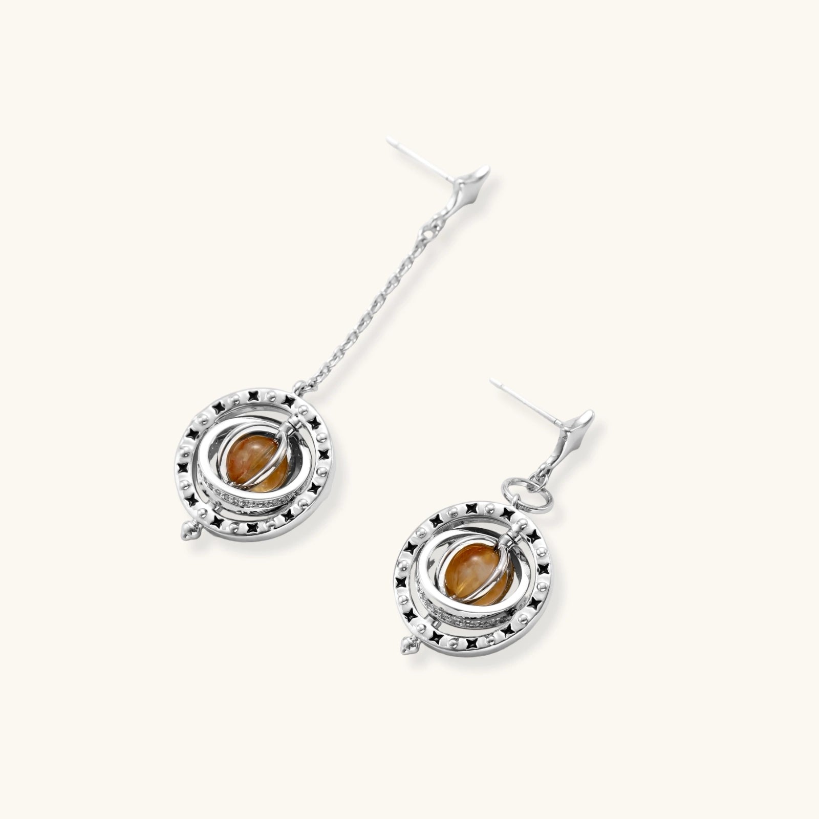 Complete jewelry set featuring citrine stone chips, silver beads, and cosmic circle pendants on cream background.