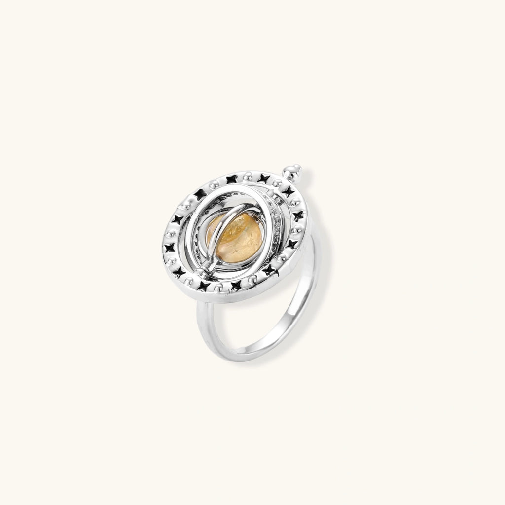 Complete jewelry set featuring citrine stone chips, silver beads, and cosmic circle pendants on cream background.